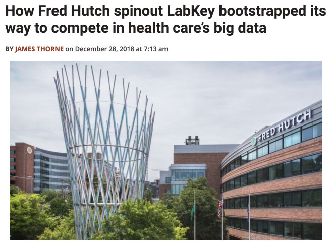 large sculpture in front of fred hutch research center