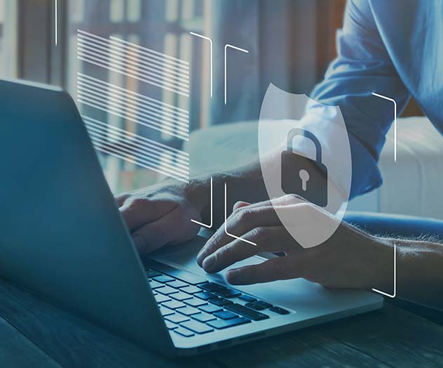 shield with lock symbol floats above open laptop