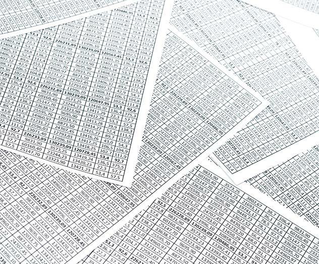 spreadsheets spread across surface